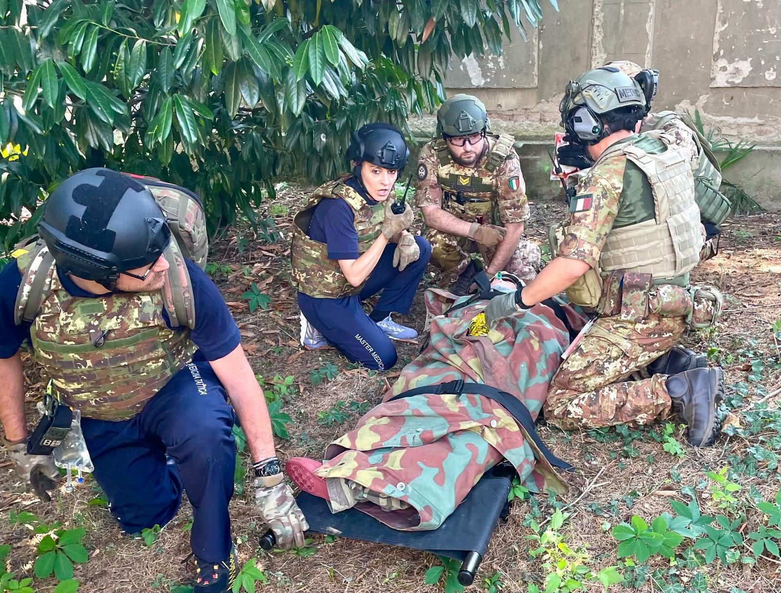 AREMT European Office — Tactical field exercise with military personnel and casualty on stretcher