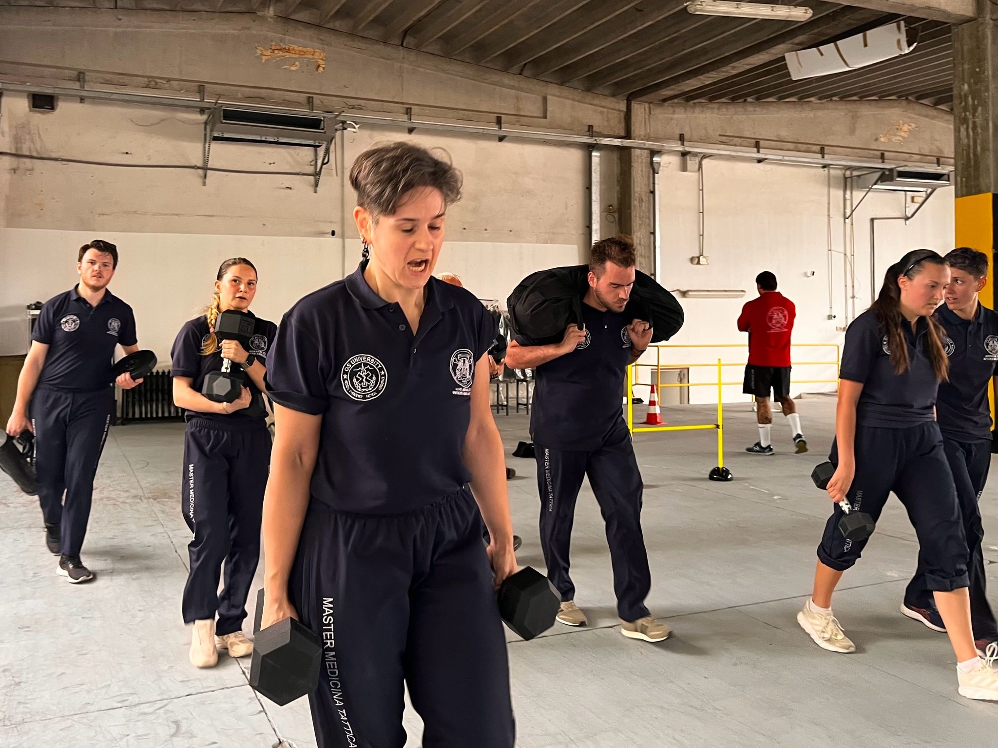 AREMT European Office — Master Medicina Tattica fitness training with dumbbells